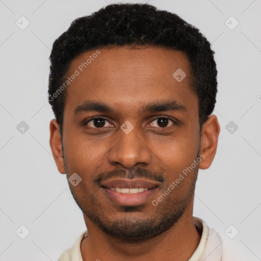 Joyful black young-adult male with short  black hair and brown eyes