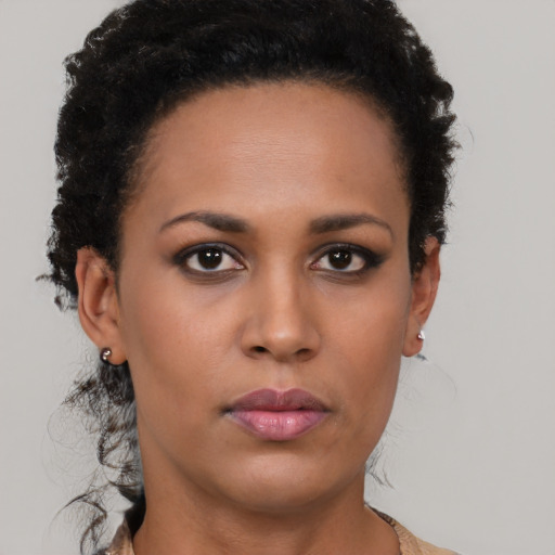 Neutral black young-adult female with short  brown hair and brown eyes
