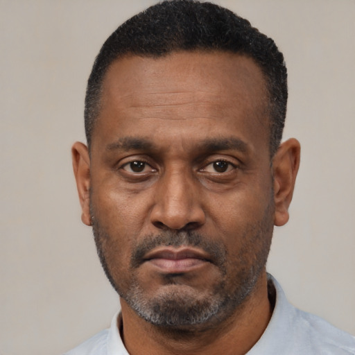 Neutral latino adult male with short  black hair and brown eyes
