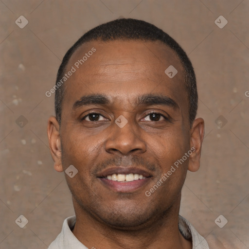 Joyful latino young-adult male with short  brown hair and brown eyes