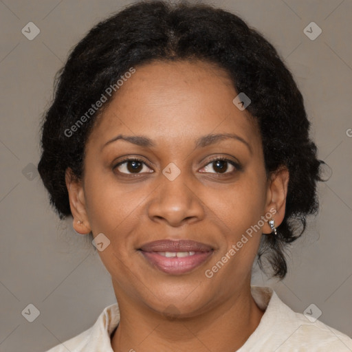 Joyful black adult female with medium  brown hair and brown eyes