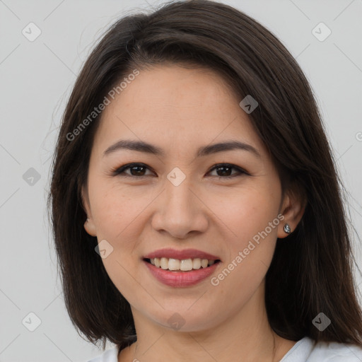 Joyful white young-adult female with long  brown hair and brown eyes