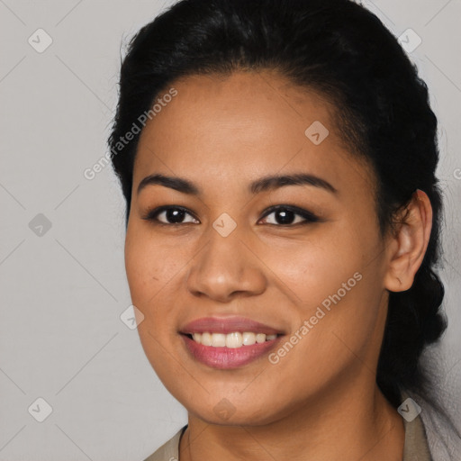 Joyful latino young-adult female with long  brown hair and brown eyes