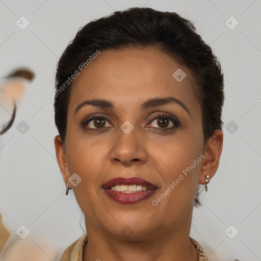 Joyful black young-adult female with short  brown hair and brown eyes