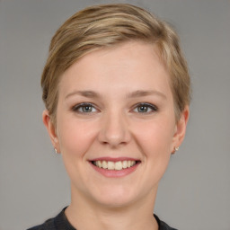 Joyful white young-adult female with short  brown hair and grey eyes