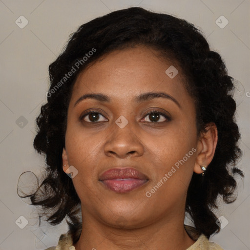Joyful black adult female with medium  brown hair and brown eyes