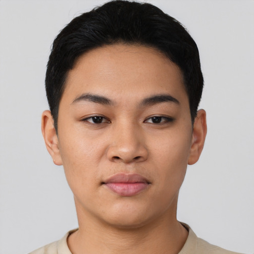 Joyful latino young-adult female with short  black hair and brown eyes