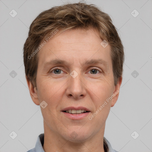 Joyful white adult male with short  brown hair and grey eyes