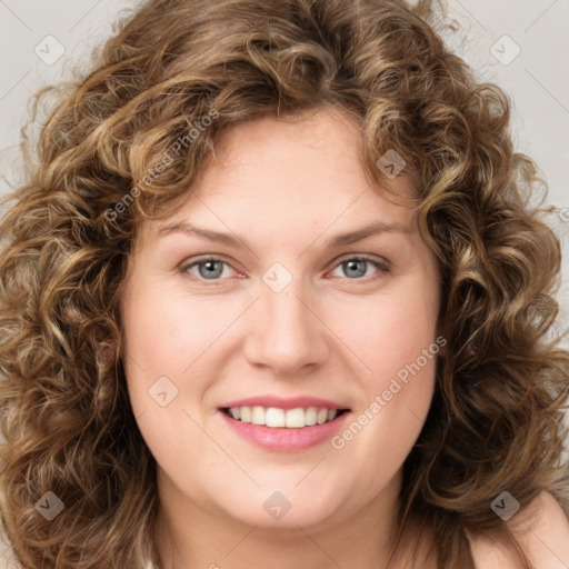 Joyful white young-adult female with long  brown hair and green eyes