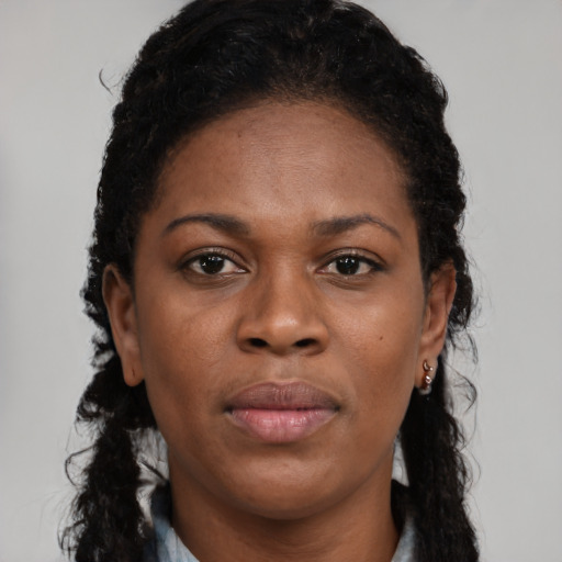 Neutral black young-adult female with long  brown hair and brown eyes