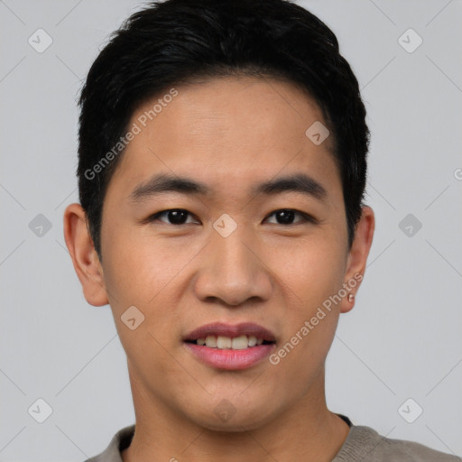 Joyful asian young-adult male with short  black hair and brown eyes