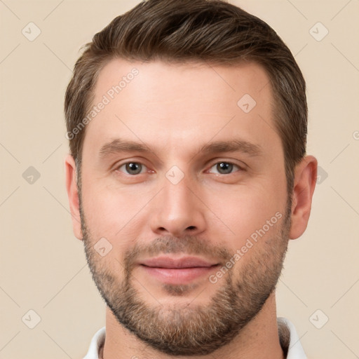 Joyful white young-adult male with short  brown hair and brown eyes