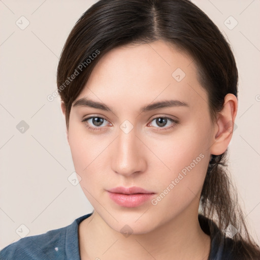 Neutral white young-adult female with long  brown hair and brown eyes