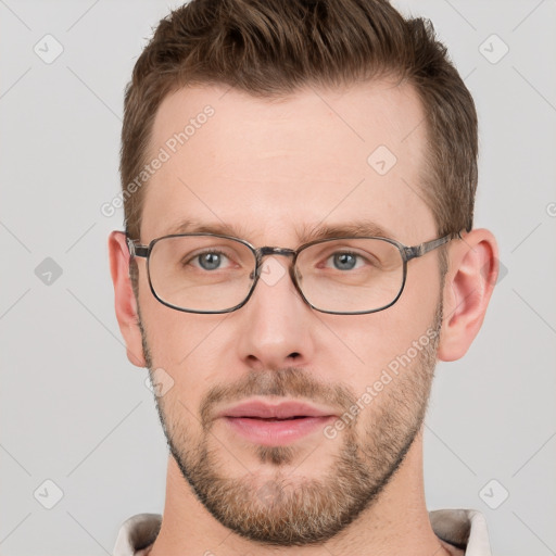 Joyful white adult male with short  brown hair and grey eyes