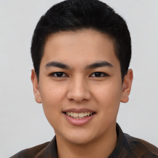 Joyful asian young-adult male with short  brown hair and brown eyes