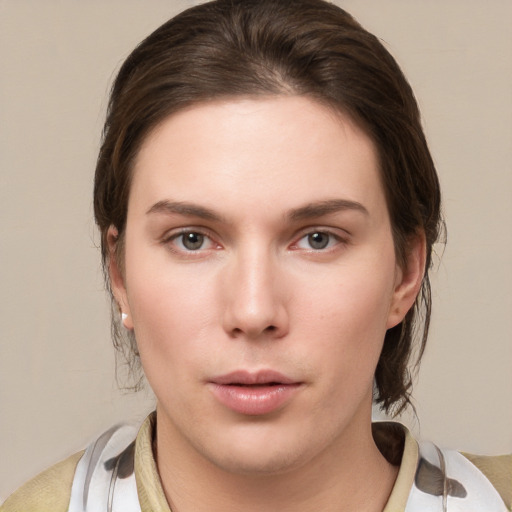 Neutral white young-adult female with medium  brown hair and brown eyes