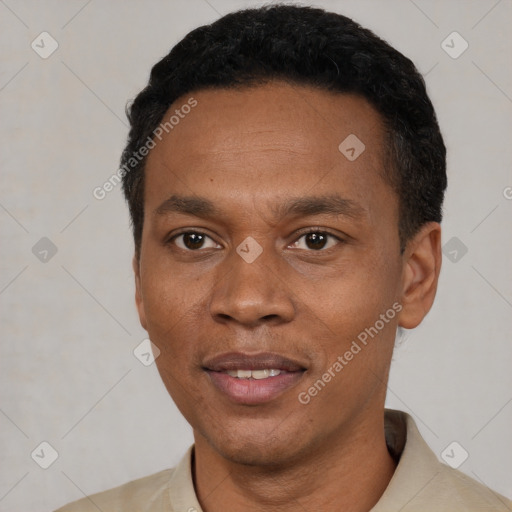 Joyful latino adult male with short  black hair and brown eyes