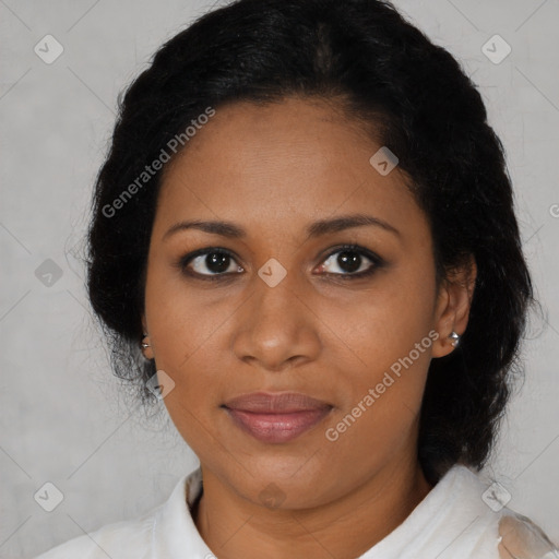 Joyful black adult female with medium  brown hair and brown eyes