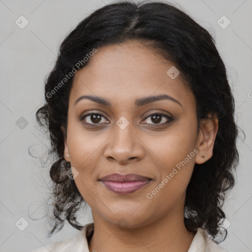 Joyful black young-adult female with long  brown hair and brown eyes