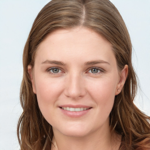 Joyful white young-adult female with long  brown hair and grey eyes