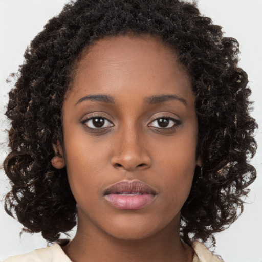 Neutral black young-adult female with long  brown hair and brown eyes