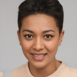 Joyful latino young-adult female with short  brown hair and brown eyes