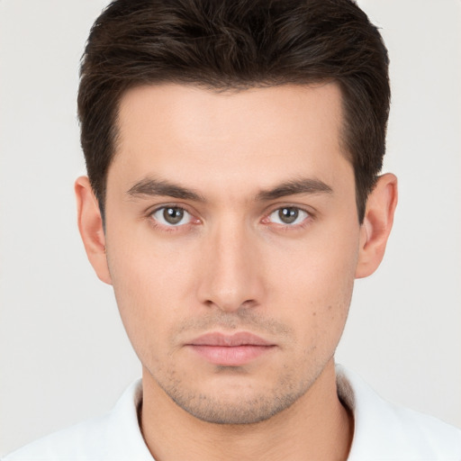 Neutral white young-adult male with short  brown hair and brown eyes