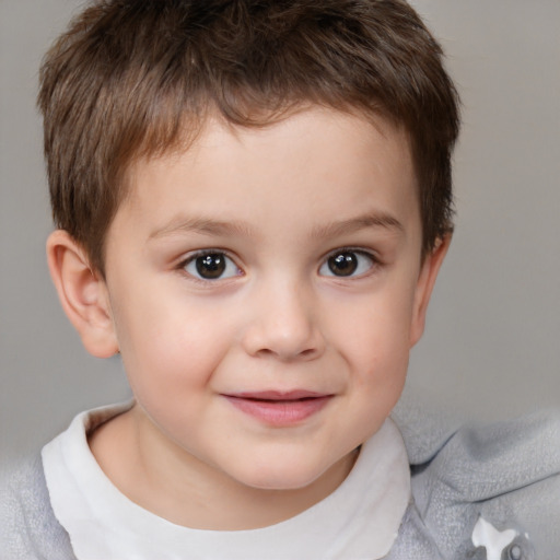 Joyful white child male with short  brown hair and brown eyes