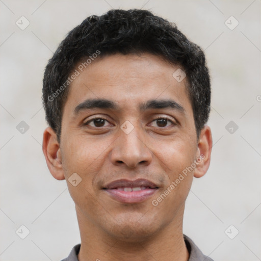 Joyful latino young-adult male with short  brown hair and brown eyes