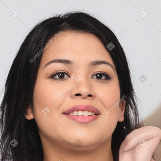 Joyful latino young-adult female with long  brown hair and brown eyes