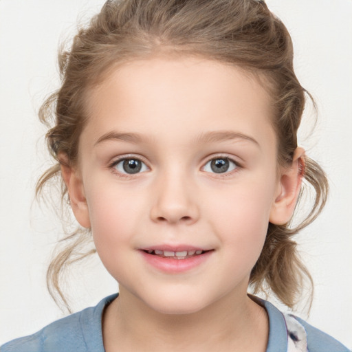 Joyful white child female with medium  brown hair and grey eyes