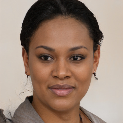 Joyful black young-adult female with short  brown hair and brown eyes