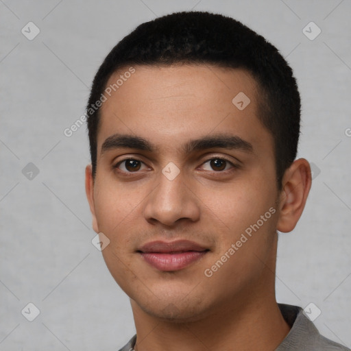 Joyful latino young-adult male with short  black hair and brown eyes