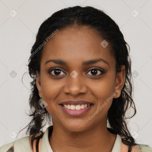 Joyful black young-adult female with long  brown hair and brown eyes