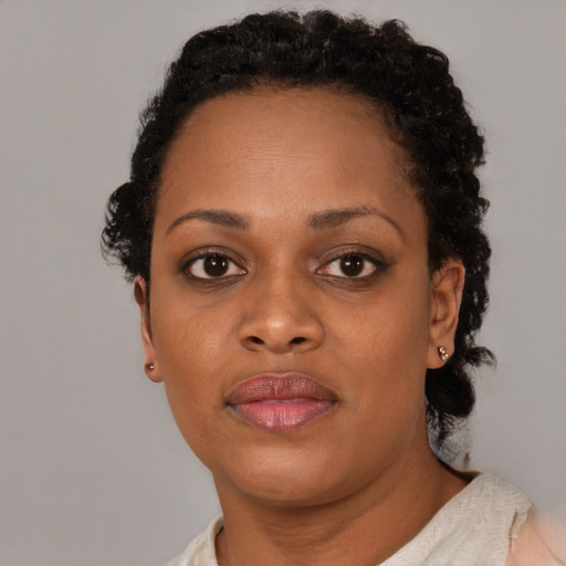 Neutral black young-adult female with short  brown hair and brown eyes