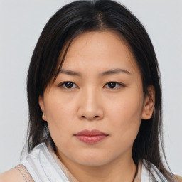 Neutral asian young-adult female with medium  brown hair and brown eyes