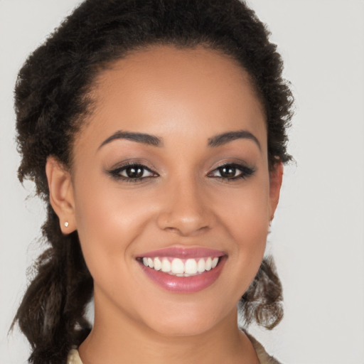 Joyful latino young-adult female with long  brown hair and brown eyes