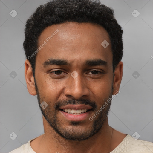 Joyful black young-adult male with short  black hair and brown eyes