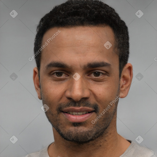 Joyful black young-adult male with short  black hair and brown eyes