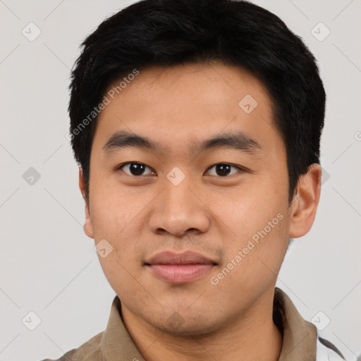 Joyful asian young-adult male with short  black hair and brown eyes