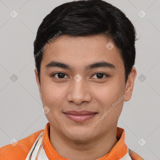 Joyful asian young-adult male with short  brown hair and brown eyes