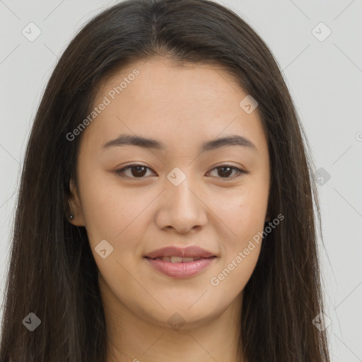 Joyful asian young-adult female with long  brown hair and brown eyes