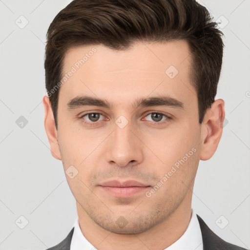 Neutral white young-adult male with short  brown hair and brown eyes