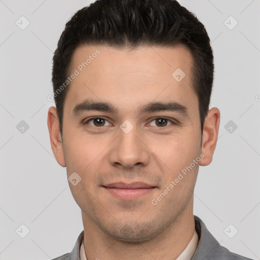 Joyful white young-adult male with short  brown hair and brown eyes