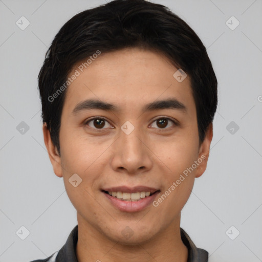 Joyful asian young-adult male with short  brown hair and brown eyes