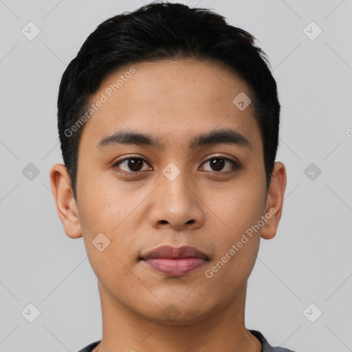Joyful asian young-adult male with short  black hair and brown eyes