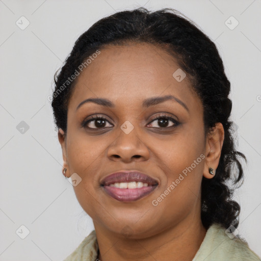 Joyful black adult female with medium  black hair and brown eyes