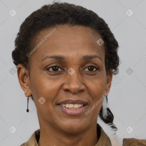 Joyful black adult female with short  brown hair and brown eyes