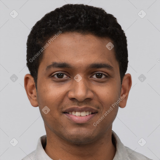 Joyful black young-adult male with short  black hair and brown eyes