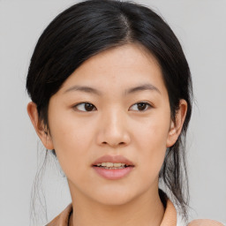 Joyful asian young-adult female with medium  black hair and brown eyes